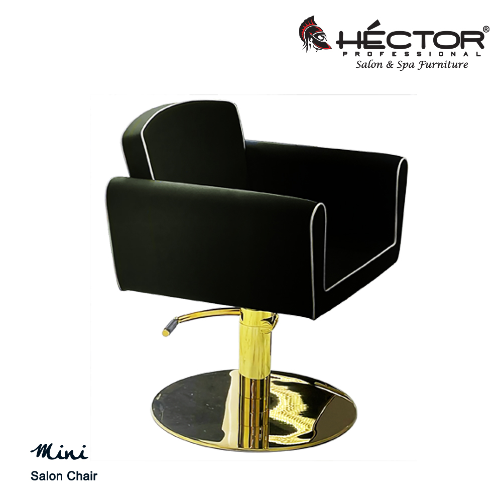 Mini Salon Chair Front-angled view of the Mini Chair in charcoal grey leatherette, highlighting the architectural "box" silhouette and square-quilted side panels.