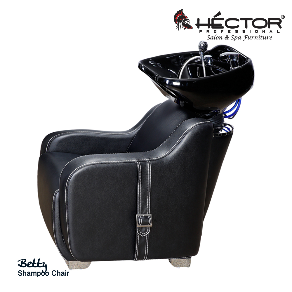 Rear view of Hector Professional Betty Shampoo station featuring black leather upholstery and a high-gloss black ceramic backwash basin with blue plumbing hoses.
