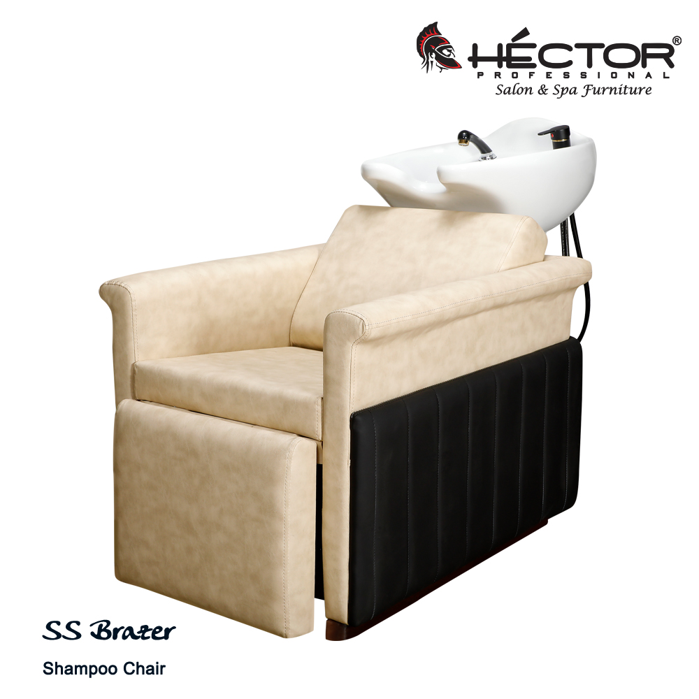 Brazer shampoo station An angled perspective of the SS Brazer Shampoo station highlighting the premium cream leatherette seating and integrated leg rest against black vertically-stitched side panels.